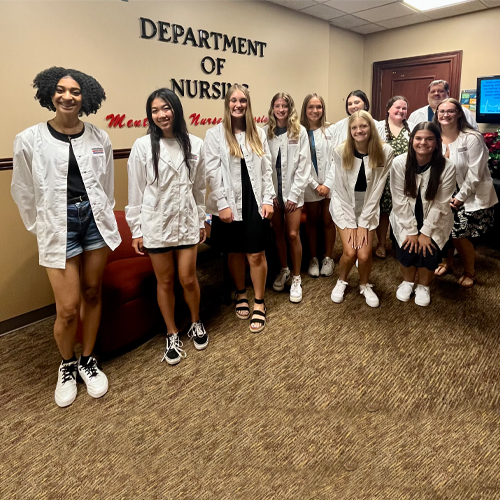 High School Nursing Students posing with instructor